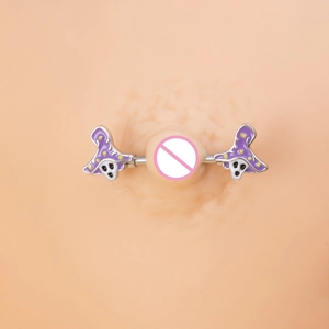 Macro view of stainless steel nipple ring with purple wizard hat and ghost decorations