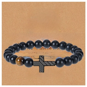 Men's matte black beads bracelet with tiger eye stone and cross on a greeting card