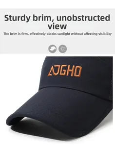 Detail of navy blue ripstop baseball cap featuring orange AJGHO embroidery and long brim
