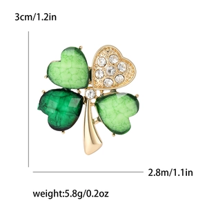 Elegant four-leaf clover brooch with green stones and sparkling rhinestones size details