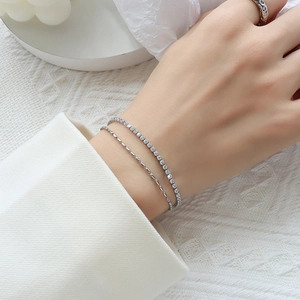 Double-layer silver stainless steel bracelet featuring zircon tennis chain and sleek bar design