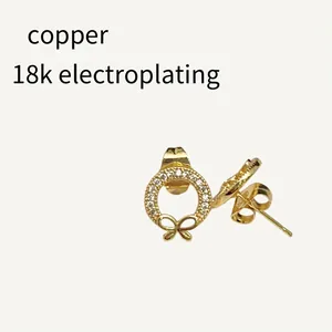 Elegant 18k gold plated copper wreath stud earrings with crystal bow detail