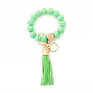 Green silicone beaded wristlet keychain with wooden bead and leather tassel charm