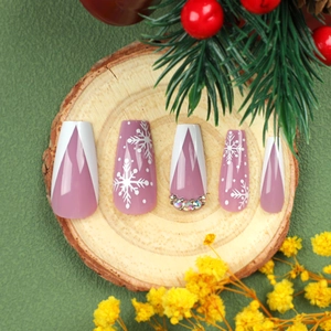 Pink and purple Christmas press-on nails with white snowflakes and glitter rhinestones