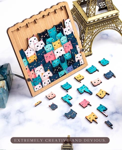 Detailed view of colorful wooden cat puzzle pieces within a frame on a marble surface
