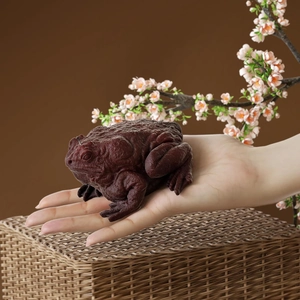 Macro detail of 3D toad candle mold featuring realistic skin texture and lifelike design