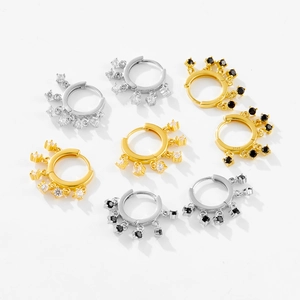 Detailed macro view of S925 sterling silver hoop earrings with zircon pendants