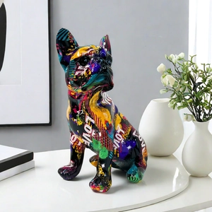 Graffiti bulldog resin sculpture with 'LOVE' text on a minimalist modern desk setup