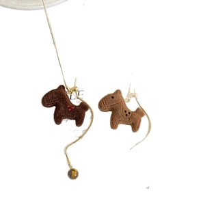 Asymmetric gold earrings with flocked pony pendants and dark brown bead accents