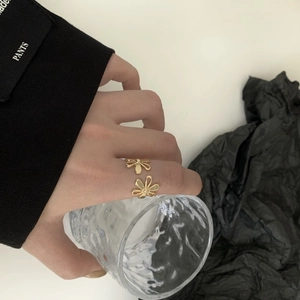 Minimalist golden open flower ring for women, stylish adjustable floral design jewelry