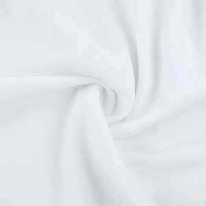 Detailed macro view of pure white knitted fabric texture with natural soft folds and draping