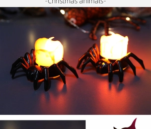 Detail of black spider LED candle lights with warm yellow glow for Halloween decor