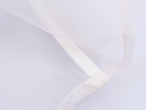 Detailed macro view of white mesh fabric texture and precise reinforced stitching edges