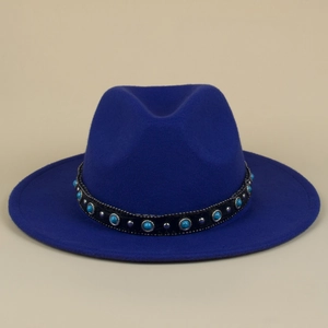 Detail of bohemian fedora hat with turquoise beads and silver studs on leather band