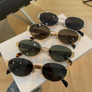 Detail of oval vintage metal sunglasses in four different frame and lens colors
