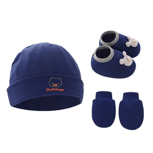 Three-piece baby set with dark blue knit hat, soft booties, and anti-scratch mittens
