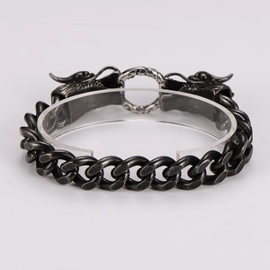 Detail of vintage punk stainless steel bracelet featuring dual dragon head clasp design