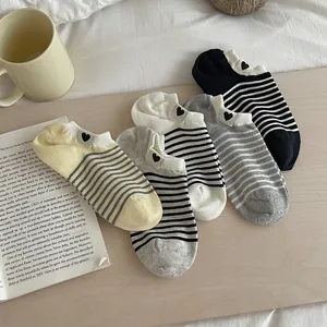 Five-pack set of women's striped low-cut ankle socks in yellow, grey, white and black colors