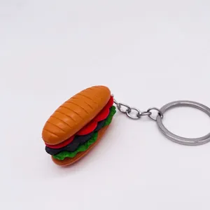 Realistic 3D food keychain featuring a sandwich or burger shape with silver metal ring