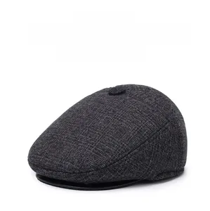 Detailed texture of thick tweed duckbill cap showing warm winter fabric and stitching