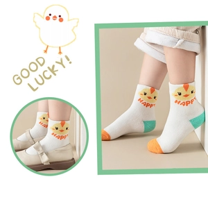 Detail of baby cotton mid-tube socks with cute chicken patterns and vibrant color blocking