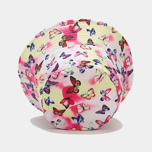 Yellow and pink tie-dye bucket hat with colorful butterfly prints for outdoor sun protection