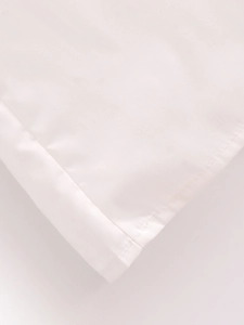 Macro shot of white woven fabric with clean stitching on this midi dress