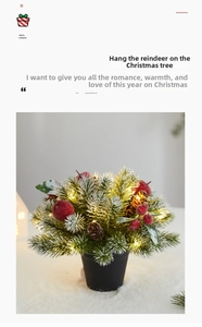 Detail of mini snowy Christmas tree with red berries, pinecones and warm LED lights