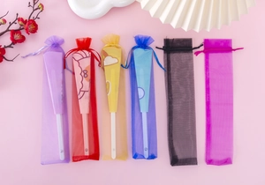 Colorful organza drawstring pouches for hand fans in purple red yellow and blue