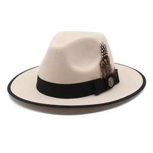 Beige wool fedora hat with black ribbon edge, feather decoration, and vintage metal buckle
