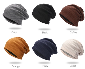 Vertical striped knit beanies in multiple colors including gray, black, and orange