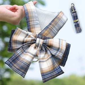Close-up of yellow and blue plaid pet harness and leash set with breathable mesh fabric