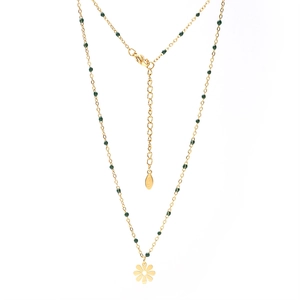 Detail of gold stainless steel necklace with green beads and daisy flower pendant