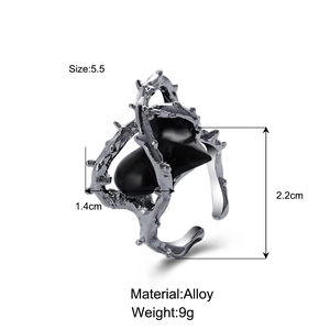Detailed view of silver thorn heart ring with black stone inlay and dimensions