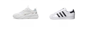 Detailed view of white chunky dad sneakers and classic shell-toe skate shoes with stripes