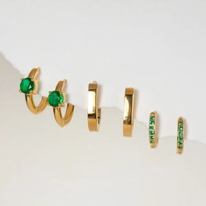 Three pairs of gold stainless steel hoop earrings with green zircon stones on white background