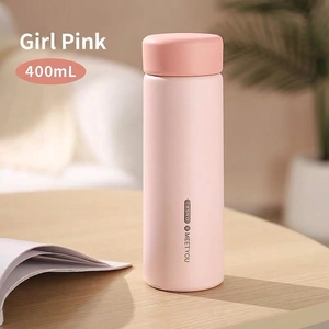 Detail of 400ml pink matte stainless steel vacuum flask with Casno logo on wood surface