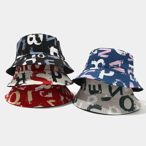 Detailed view of 5 colors of reversible bucket hats with vintage graffiti letter prints