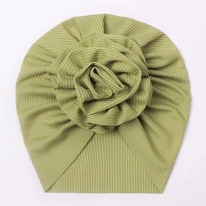 Detail of olive green ribbed knit baby turban with a large dimensional 3D rose flower