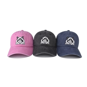Detailed embroidery of cat faces on washed cotton baseball caps in three colors