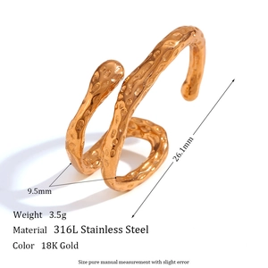 Irregular textured spiral 18K gold plated stainless steel clip earring with a hammered finish