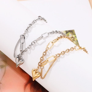 Gold and silver heart pendant bracelets with mixed paperclip and cable chain links