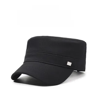 Detail of black breathable flat top cap with high-quality stitching and metal nameplate