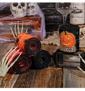 Detail of Halloween decorative ribbons with spider web and pumpkin glitter prints