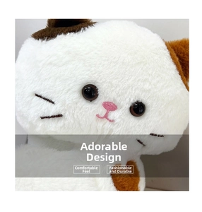Close-up of cute plush cat bag featuring embroidered facial details and soft fur