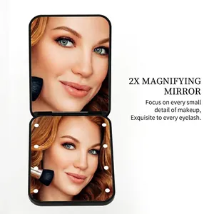 Portable LED makeup mirror with 2x magnification and 8 integrated light beads
