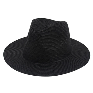 Detailed view of the fine spiral weave and flat brim on this black Panama straw hat