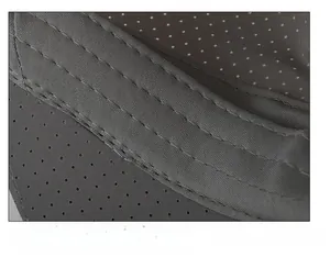 Macro detail of breathable perforated sweatband with reinforced stitching on a grey flat cap