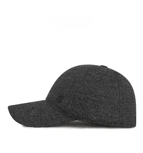 Detailed side view of dark grey wool blend baseball cap with metallic G emblem