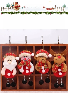 Detail of four Christmas tree ornaments showing Santa, Snowman, Bear, and Reindeer dolls